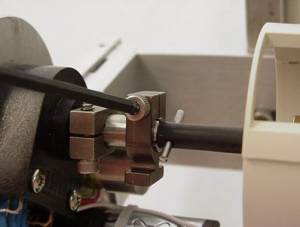 Figure 10: Tightening the zoom drive shaft clamp