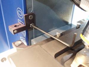 Figure 2a Plunger stop mounts to stage carrier with the two screws as shown.